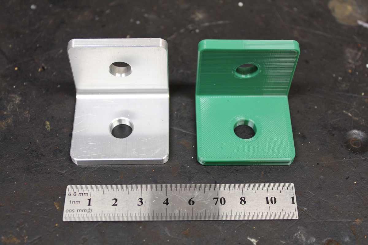Identical L-bracket made on a CNC in aluminum versus 3D-printed in PLA